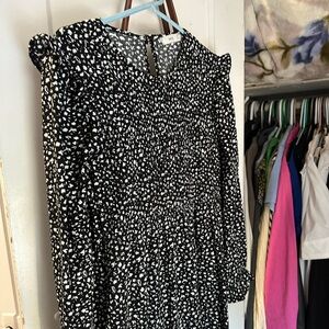 Mango mid length dress in shade black and pattern with ruffles. Size is small.